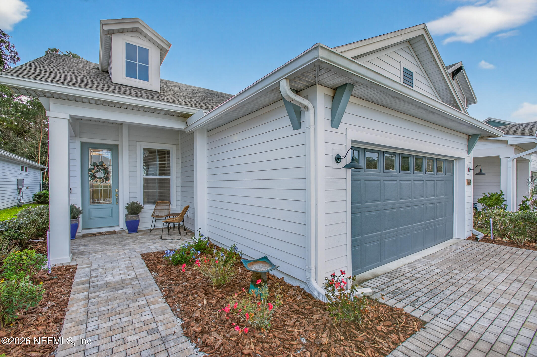 237 Windswept Way Street St. Augustine, FL 32092 - Photo 5 of 136 a front view of a house with garden