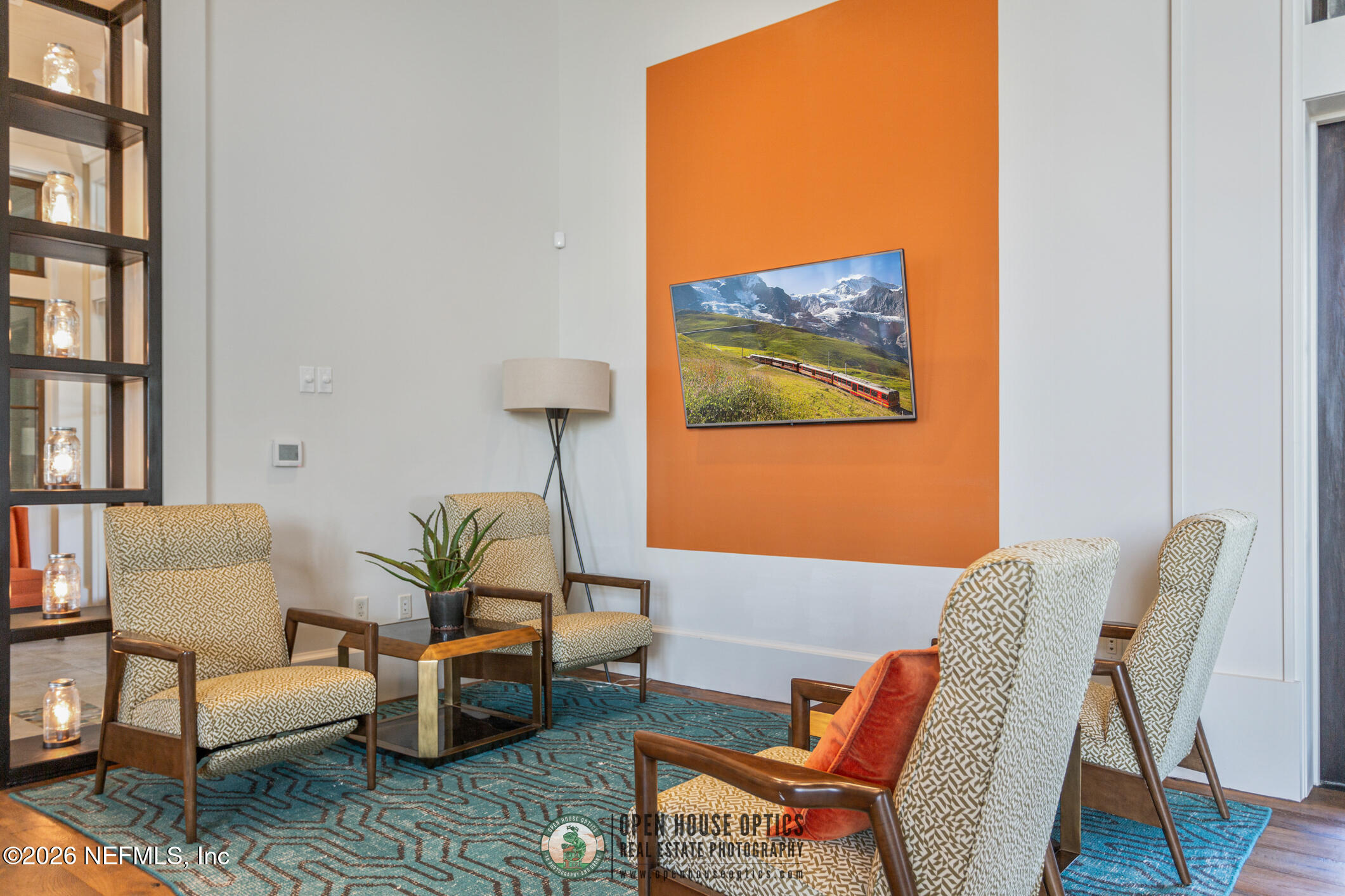 237 Windswept Way Street St. Augustine, FL 32092 - Photo 59 of 136 a living room with furniture a rug and a wall painting