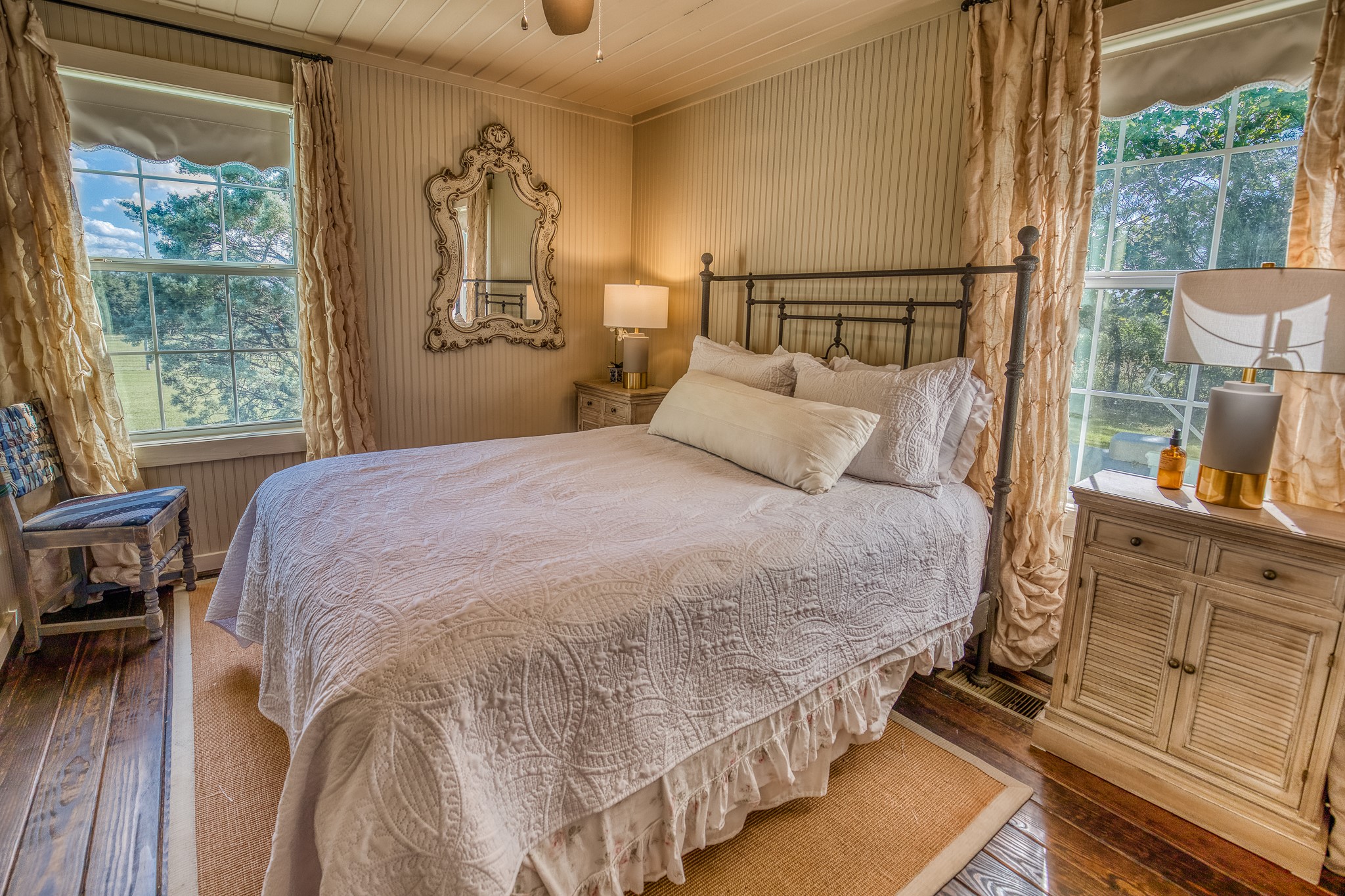 4825 Mt Vernon Road Brenham, TX 77833 - Photo 16 of 30 a bedroom with a bed and wooden floor