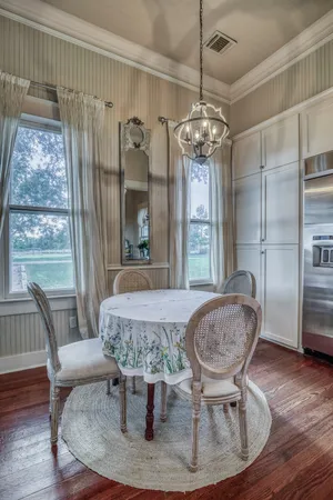 a view of a kitchen counter space dining table and wooden floor