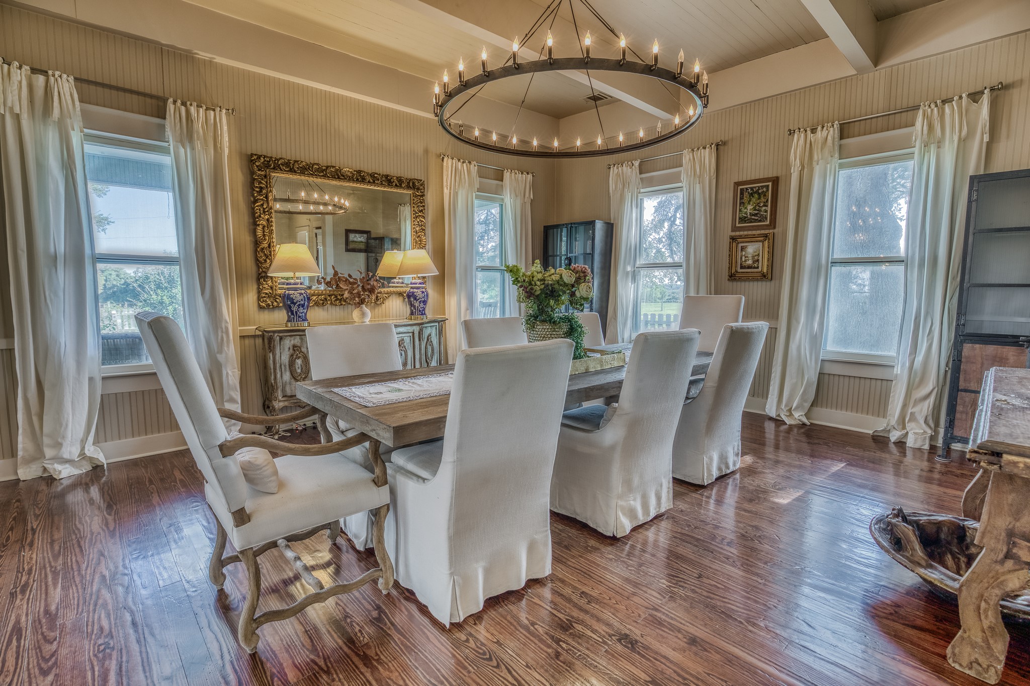 4825 Mt Vernon Road Brenham, TX 77833 - Photo 7 of 30 a view of a dining room with furniture window and wooden floor