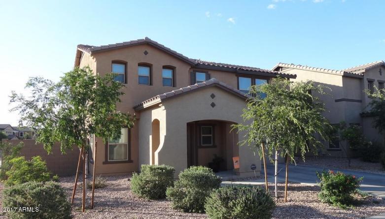 11026 West Elm Street Phoenix, AZ 85037 - Photo 1 of 20 a front view of a house with a yard