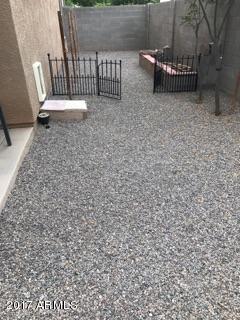 11026 West Elm Street Phoenix, AZ 85037 - Photo 19 of 20 a view of a porch with a bench