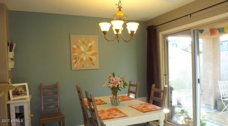 11026 West Elm Street Phoenix, AZ 85037 - Photo 4 of 20 a room with table and window