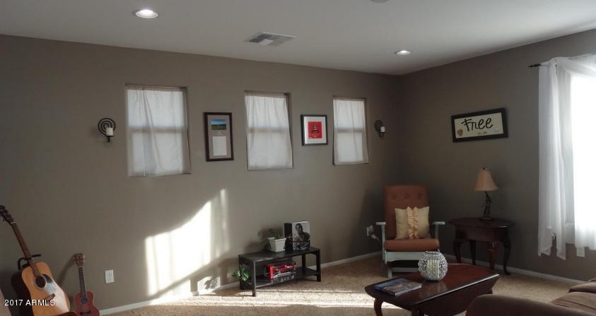 11026 West Elm Street Phoenix, AZ 85037 - Photo 9 of 20 a living room with furniture
