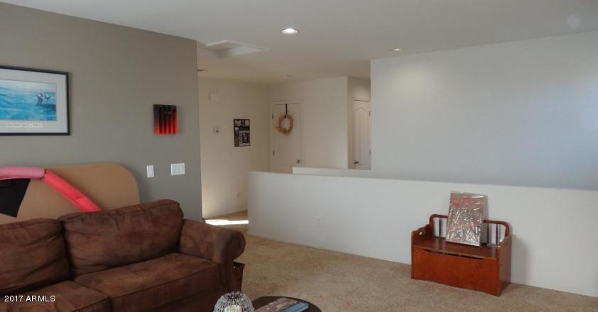 11026 West Elm Street Phoenix, AZ 85037 - Photo 10 of 20 a living room with furniture