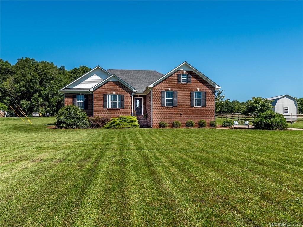 2910 Ruben Road Monroe, NC 28112 - Photo 1 of 29 a front view of a house with a yard