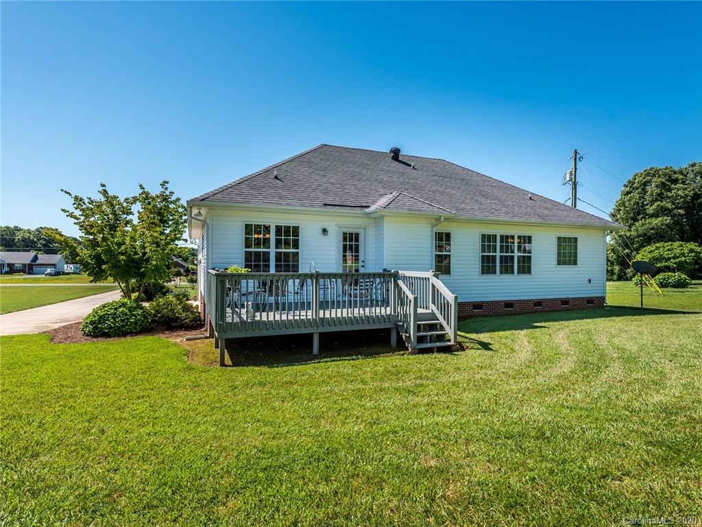2910 Ruben Road Monroe, NC 28112 - Photo 26 of 29 a view of a house with a yard patio and a small yard