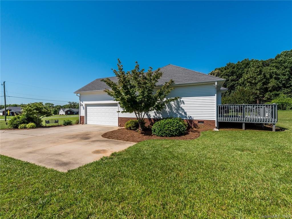 2910 Ruben Road Monroe, NC 28112 - Photo 27 of 29 a front view of a house with a yard and garage
