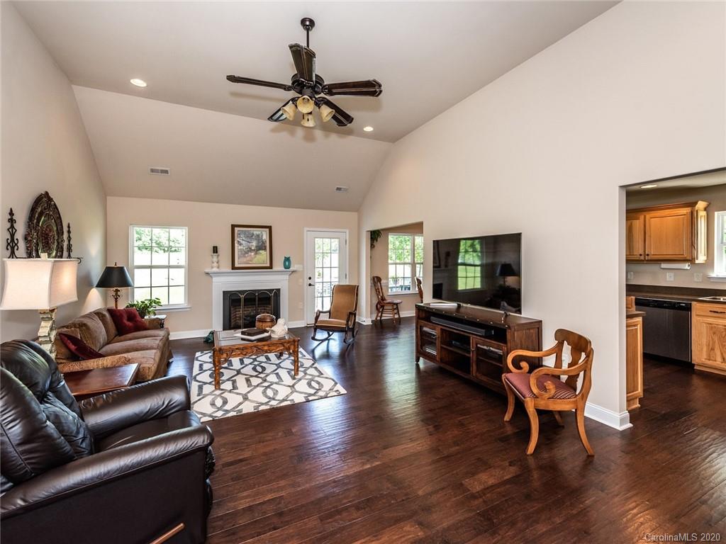 2910 Ruben Road Monroe, NC 28112 - Photo 4 of 29 a living room with fireplace furniture and a flat screen tv