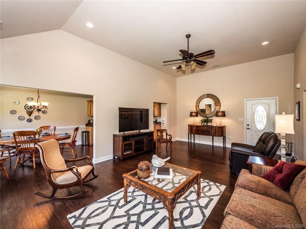 2910 Ruben Road Monroe, NC 28112 - Photo 6 of 29 a living room with furniture a rug and a flat screen tv