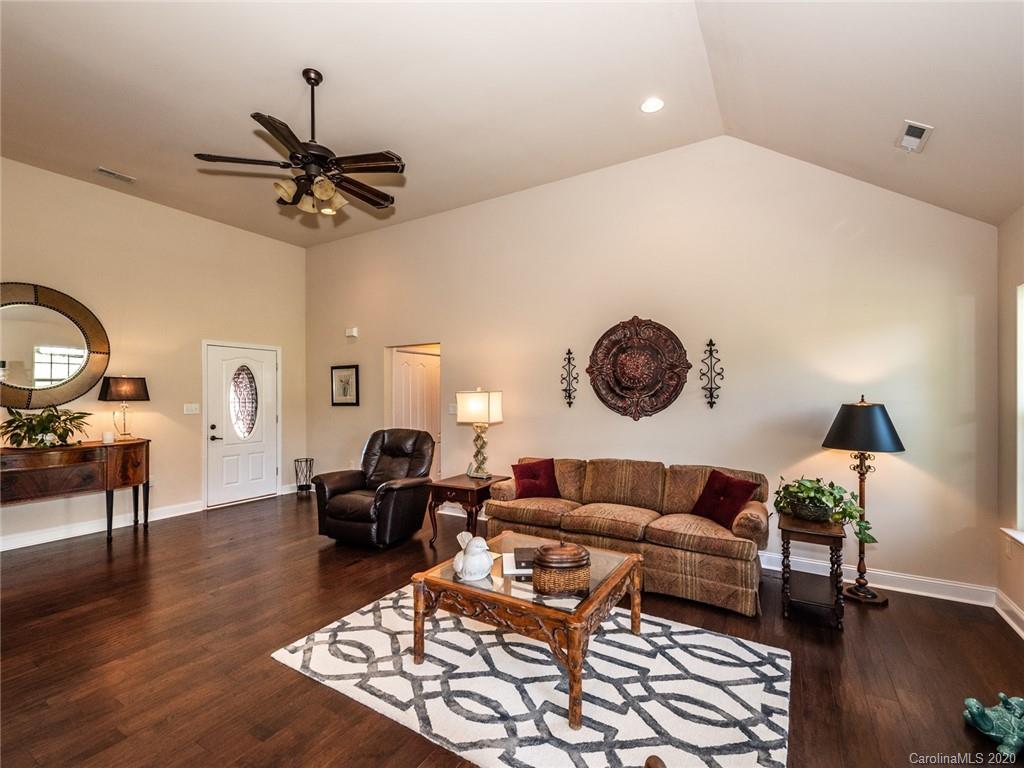 2910 Ruben Road Monroe, NC 28112 - Photo 7 of 29 a living room with furniture and a wooden floor