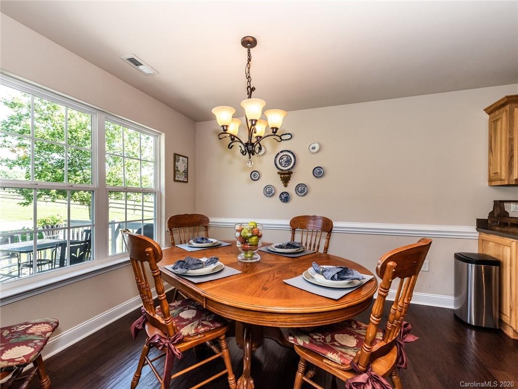 2910 Ruben Road Monroe, NC 28112 - Photo 8 of 29 a view of a dining room with furniture window and wooden floor