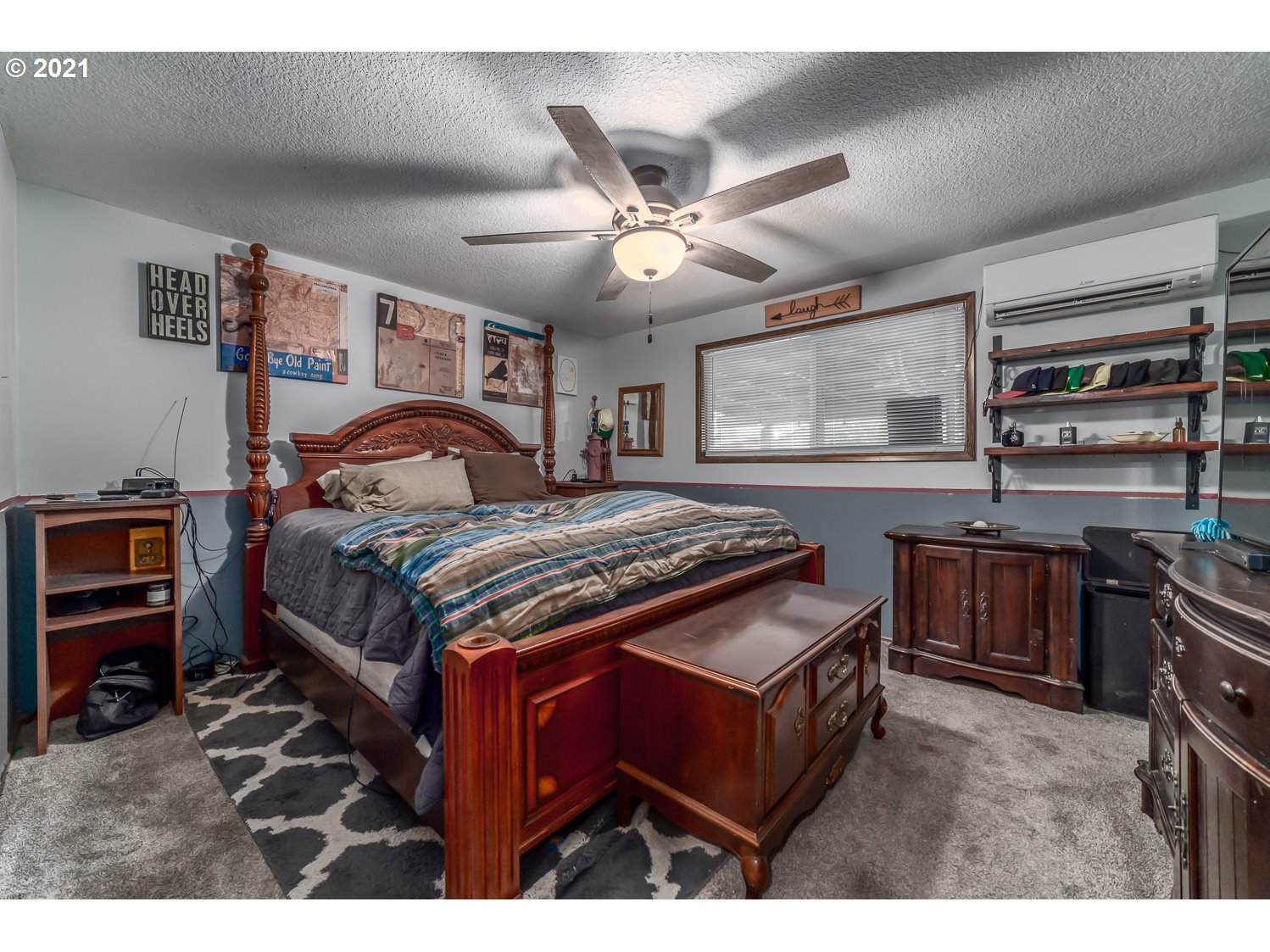 471 67th Street Springfield, OR 97478 - Photo 17 of 28 a bedroom with a bed and a chandelier