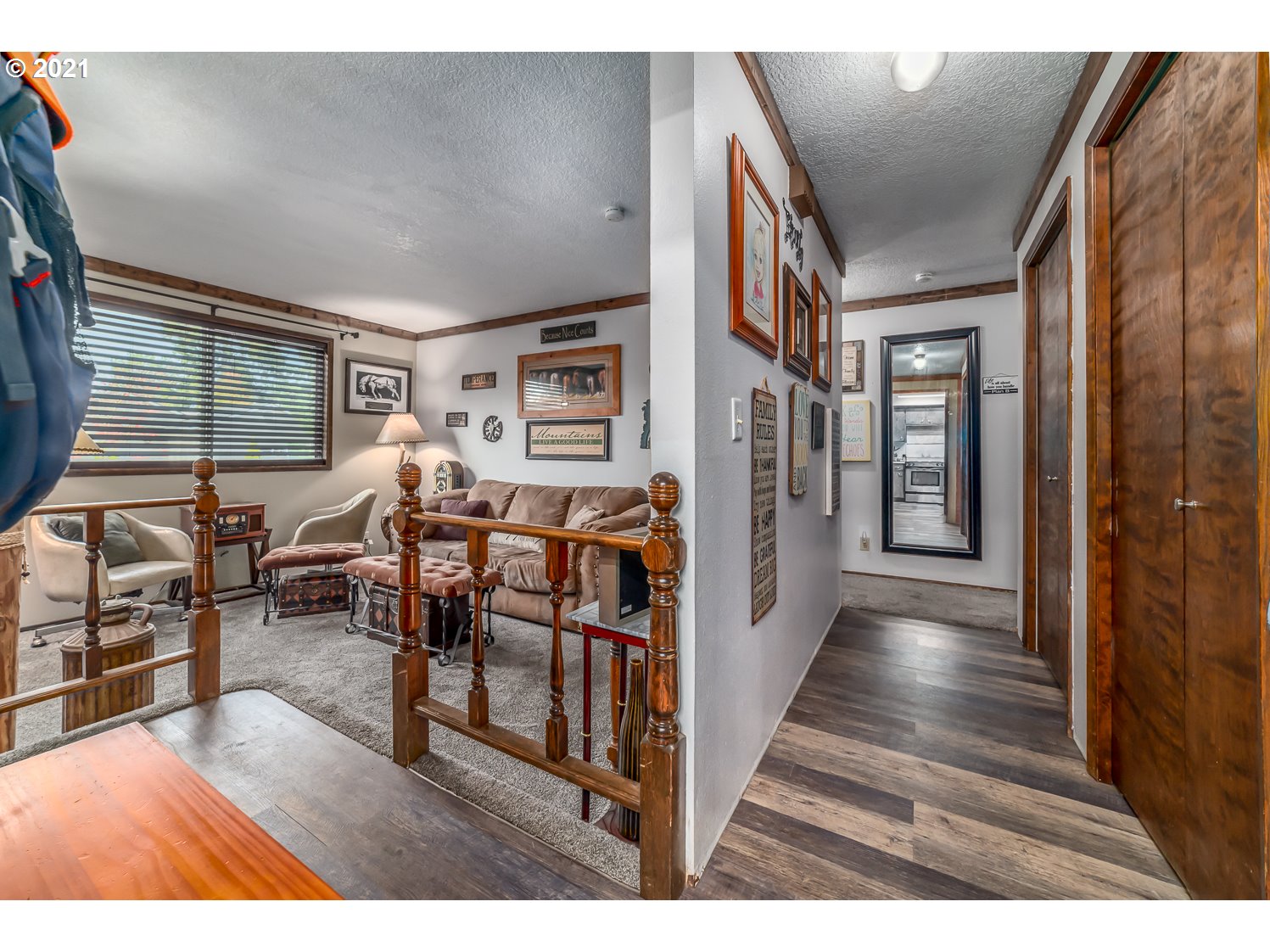 471 67th Street Springfield, OR 97478 - Photo 7 of 28 a view of a porch and dining room with furniture window and wooden floor