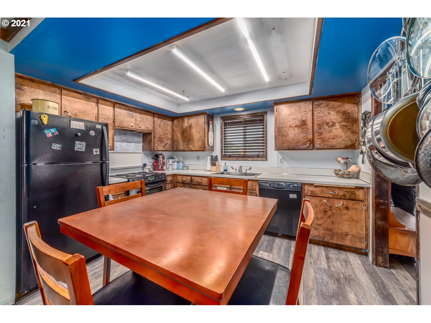 471 67th Street Springfield, OR 97478 - Photo 8 of 28 a kitchen with stainless steel appliances granite countertop a sink a stove top oven a counter space and cabinets