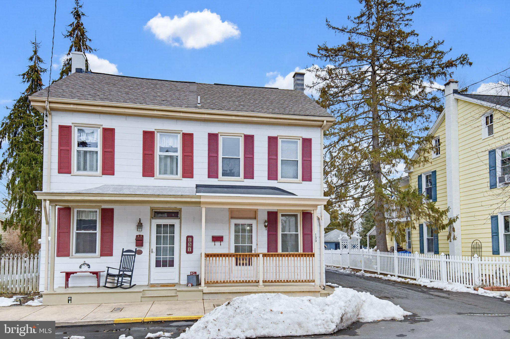 a front view of a residential apartment building with a yard
