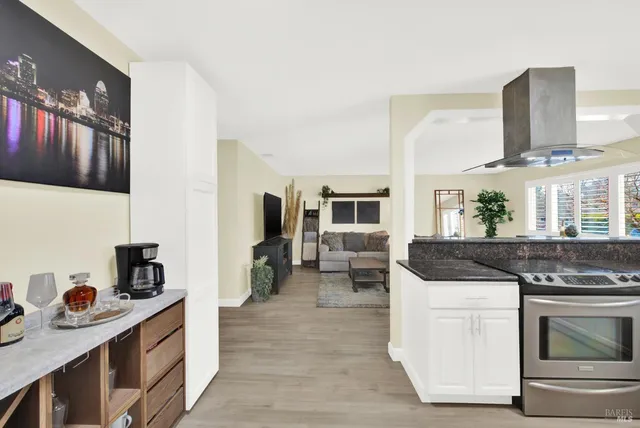 a kitchen with stainless steel appliances granite countertop a stove and a sink