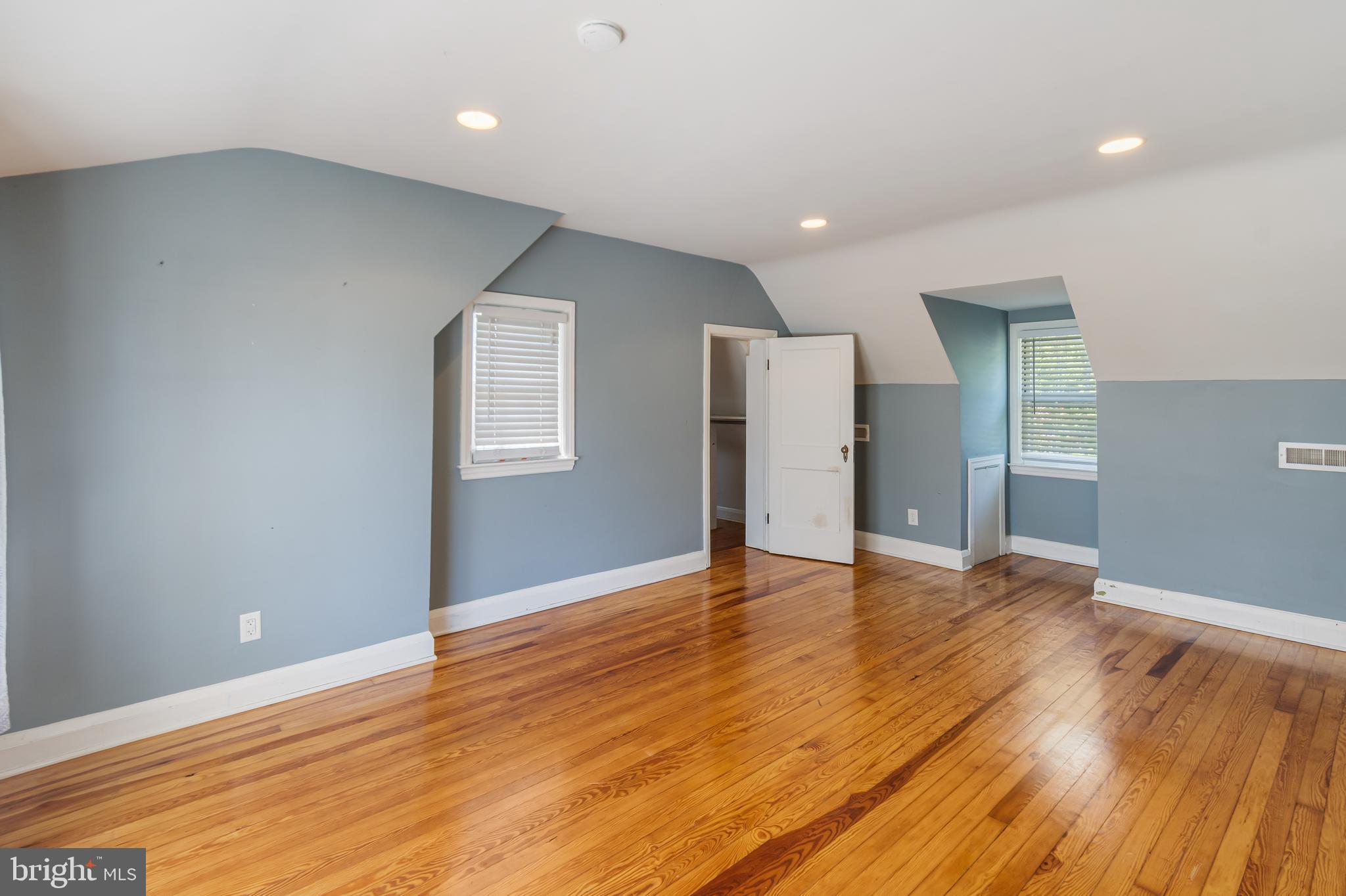 113 Homewood Road Linthicum Heights, MD 21090 - Photo 15 of 34 a view of an empty room with wooden floor and a window