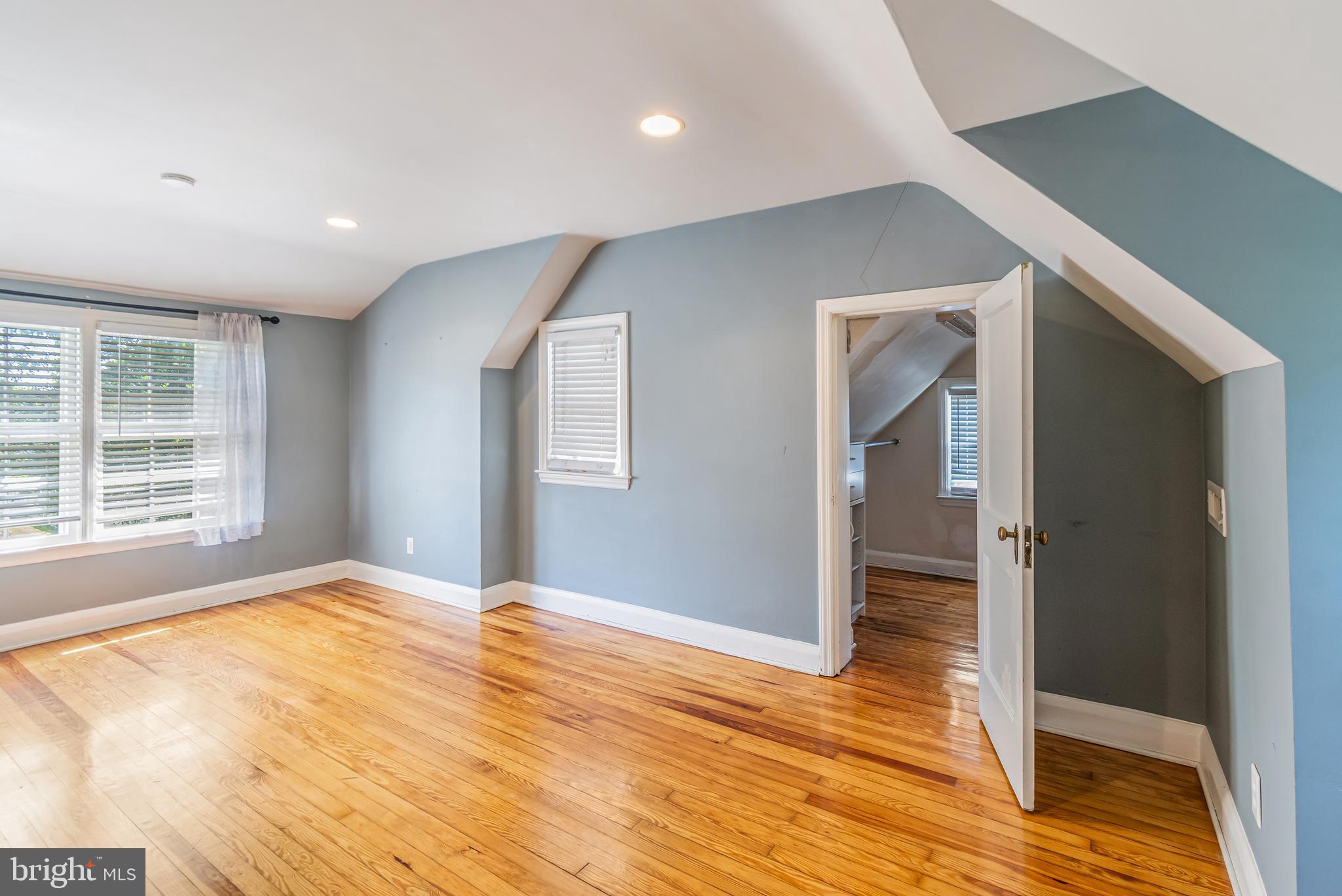 113 Homewood Road Linthicum Heights, MD 21090 - Photo 16 of 34 a view of an empty room with wooden floor and a window