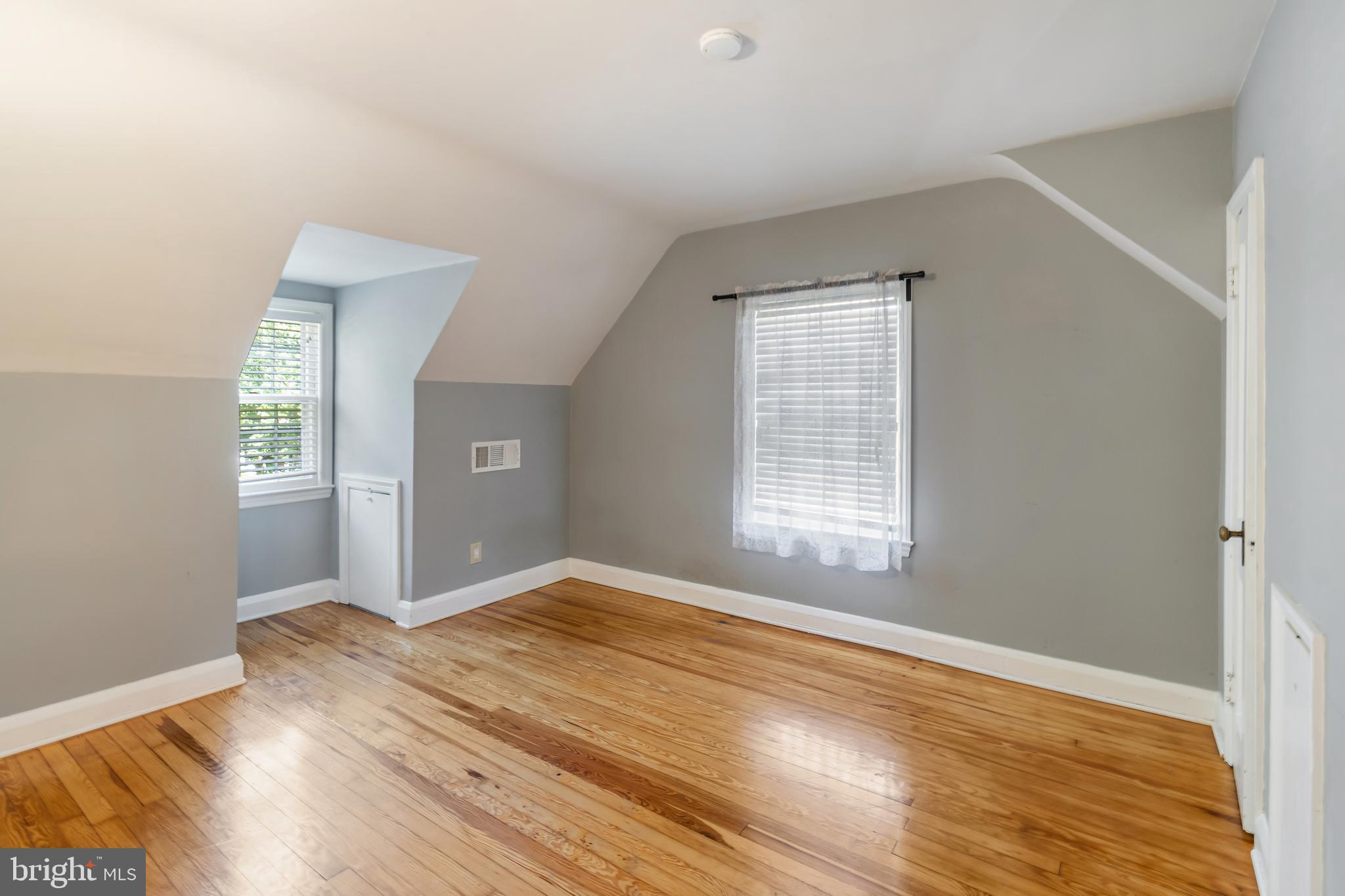 113 Homewood Road Linthicum Heights, MD 21090 - Photo 22 of 34 a view of an empty room with wooden floor and a window