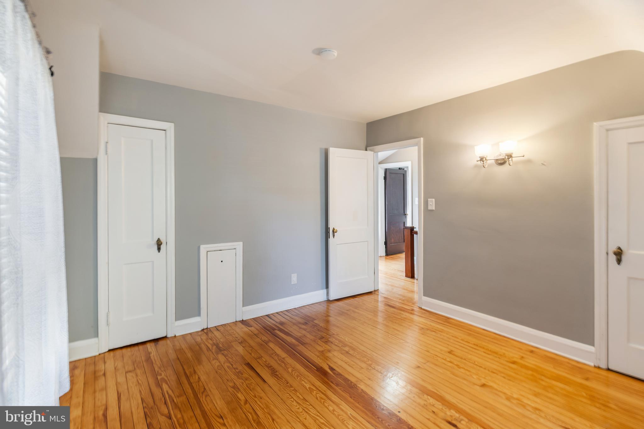 113 Homewood Road Linthicum Heights, MD 21090 - Photo 23 of 34 a view of a room with wooden floor and a bathroom