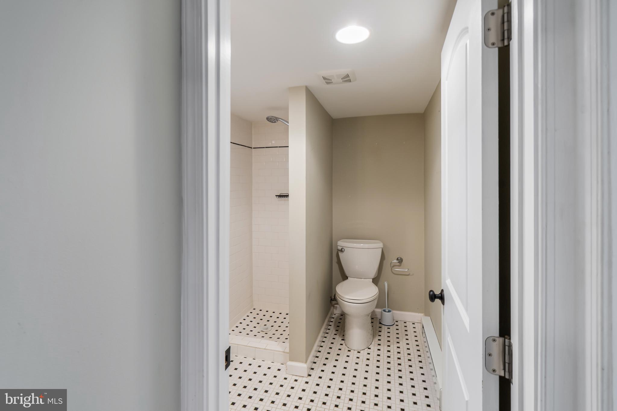 113 Homewood Road Linthicum Heights, MD 21090 - Photo 29 of 34 a bathroom with a toilet and a shower