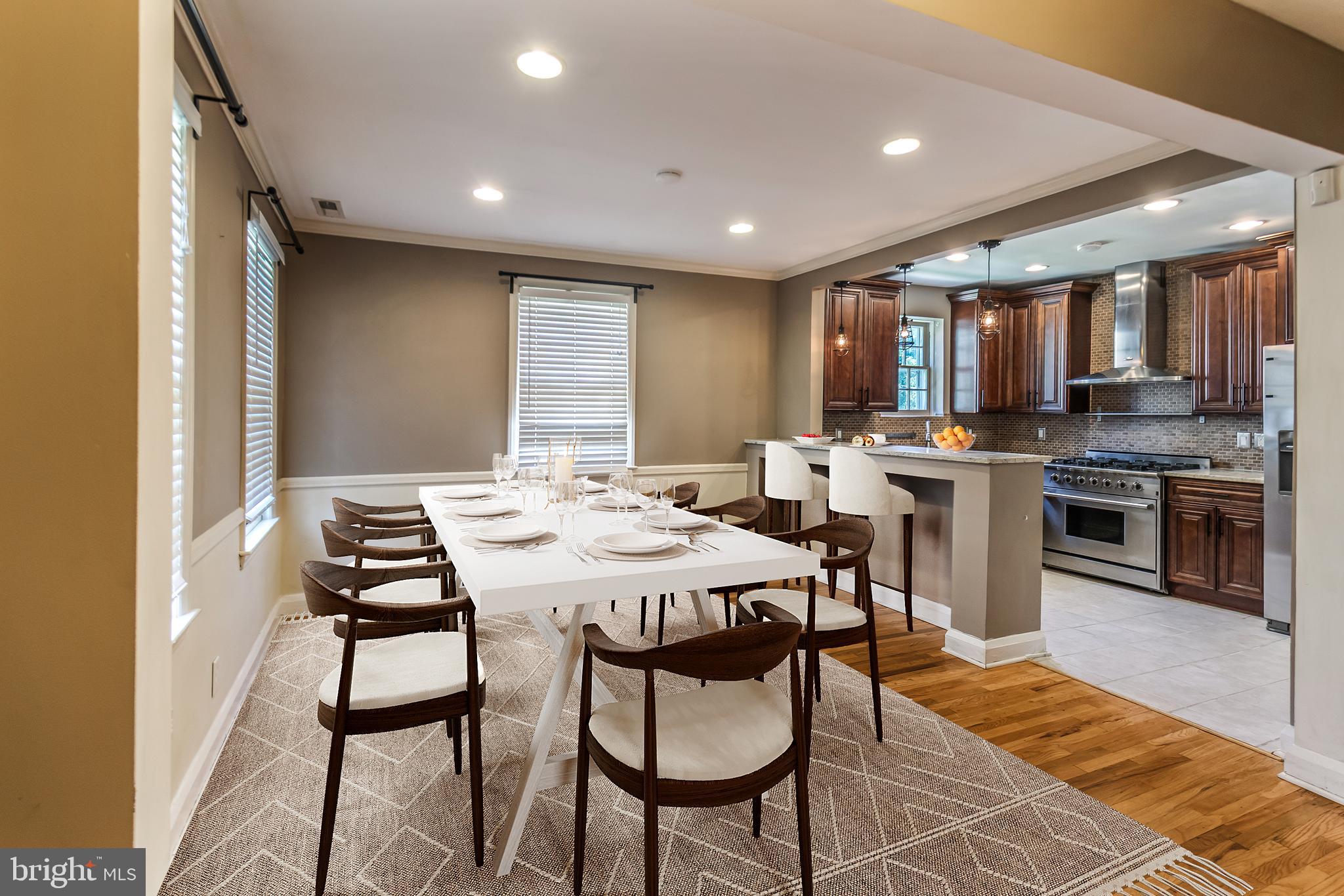 113 Homewood Road Linthicum Heights, MD 21090 - Photo 5 of 34 a kitchen with a table and chairs in it