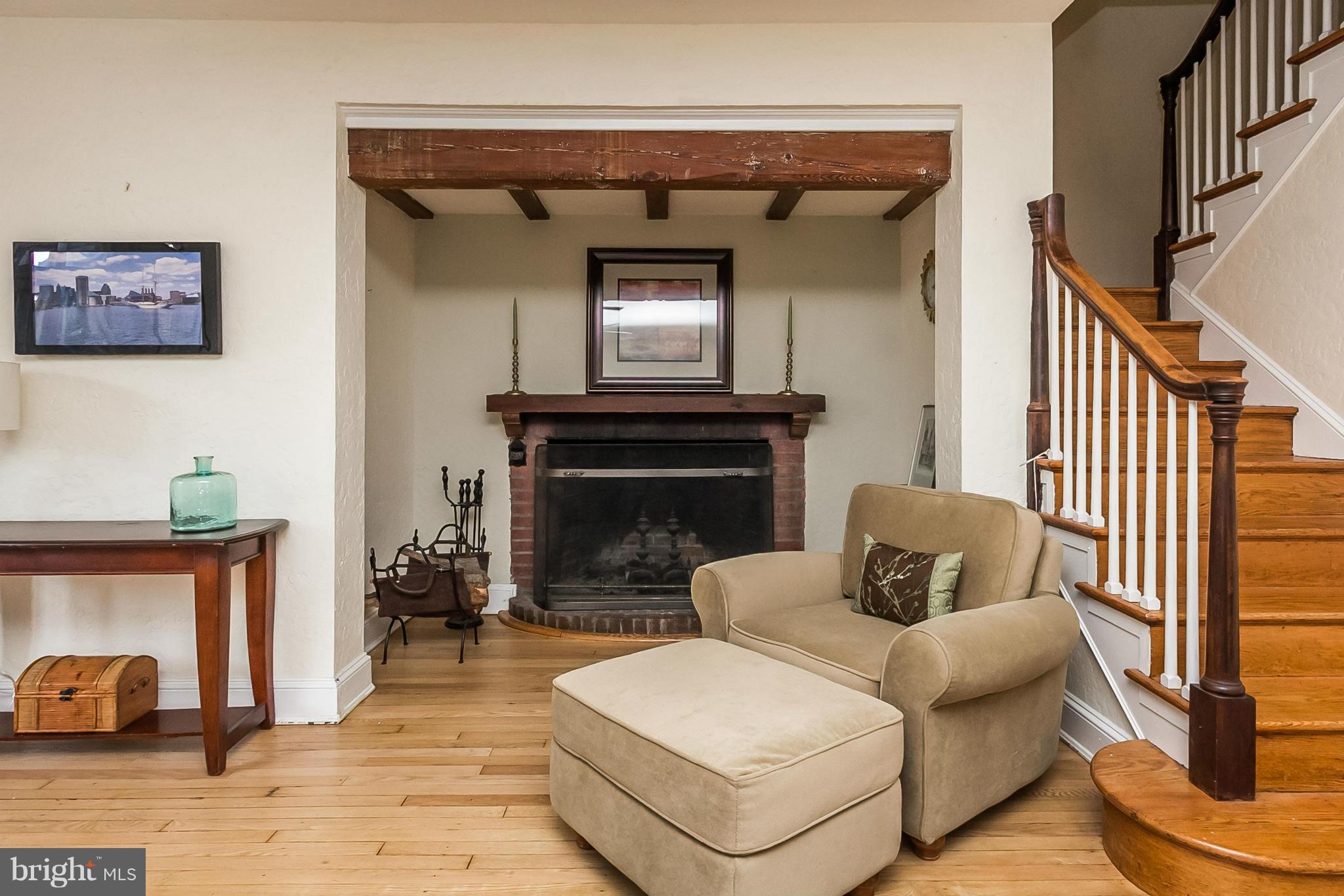 207 Ridgemede Road Baltimore, MD 21210 - Photo 8 of 30 a living room with furniture and a fireplace