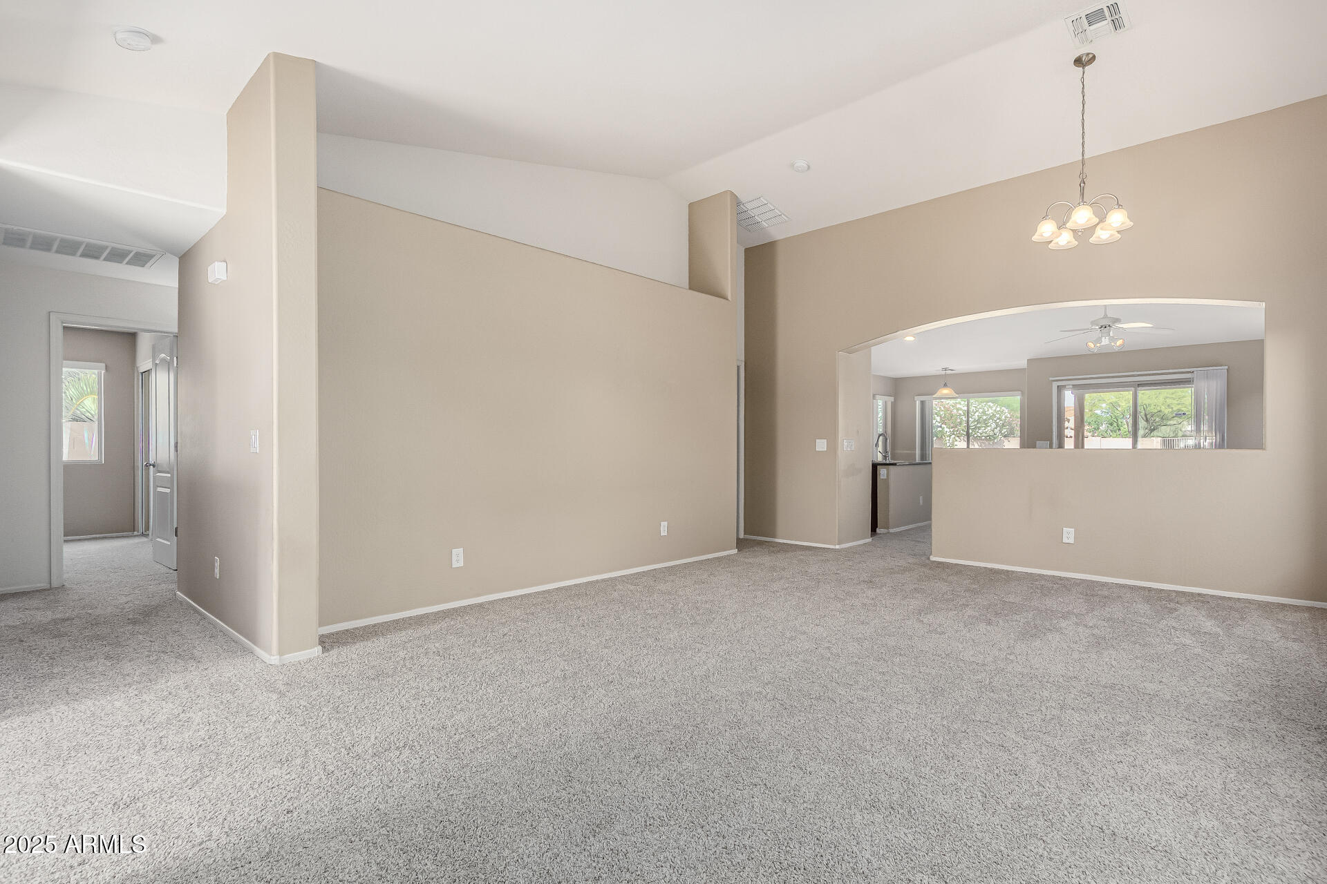 315 South 112th Drive Avondale, AZ 85323 - Photo 3 of 20 a view of an empty room with a window