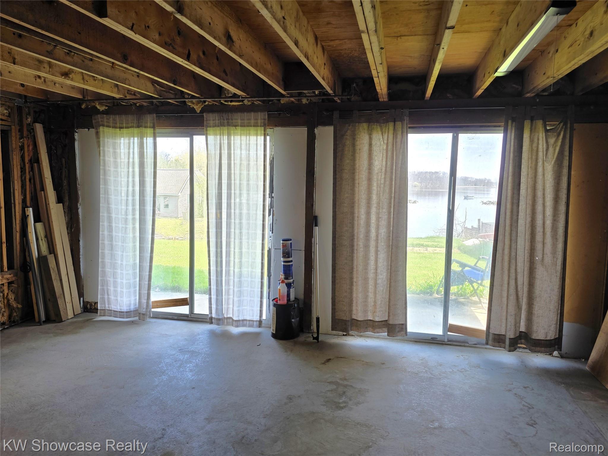 6354 Bennett Lake Road Fenton, MI 48430 - Photo 40 of 41 Misc room with a water view and concrete floors
