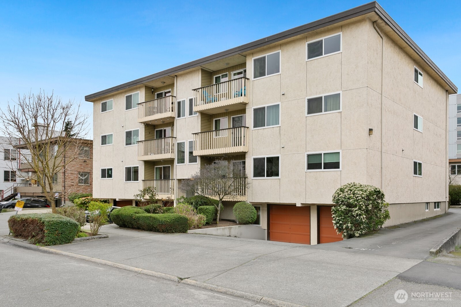 2031 Northwest 59th Street, Unit 101 Seattle, WA 98107 - Photo 1 of 22 a view of a large white building