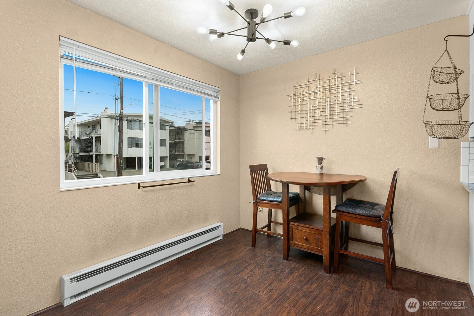 2031 Northwest 59th Street, Unit 101 Seattle, WA 98107 - Photo 11 of 22 a view of a dining room with furniture window and wooden floor