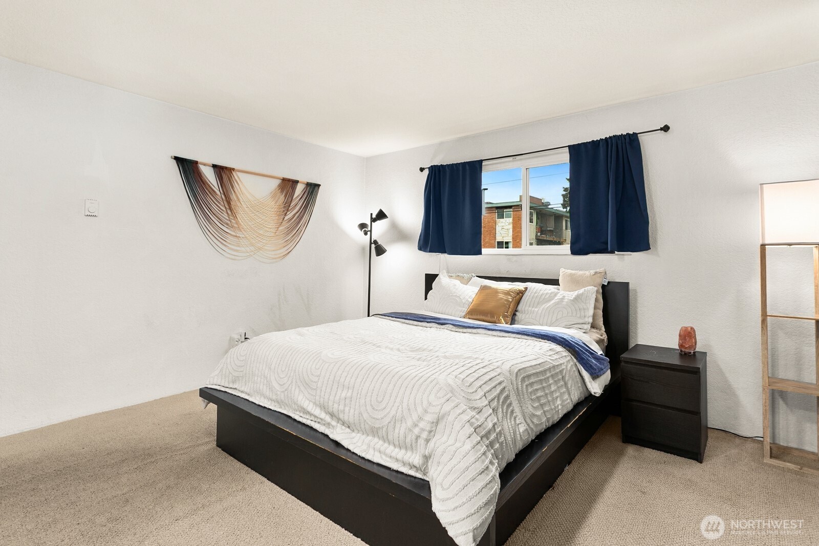 2031 Northwest 59th Street, Unit 101 Seattle, WA 98107 - Photo 18 of 22 a bed room with a bed and a television