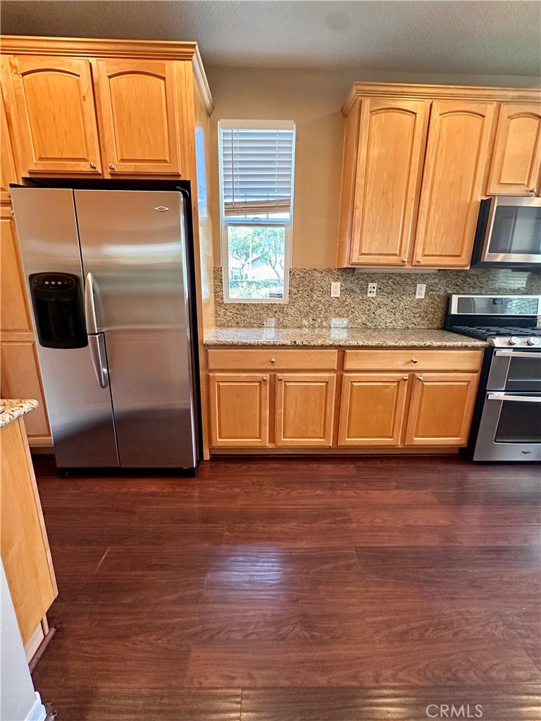 51 Ethereal Ladera Ranch, CA 92694 - Photo 4 of 14 a view of a kitchen with wooden floor and a sink