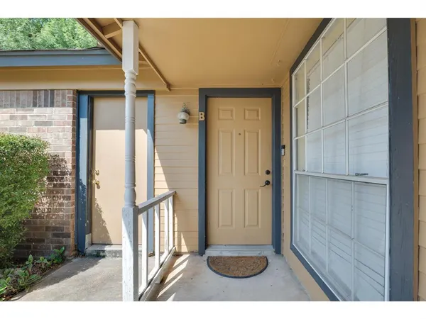 a view of entryway with wooden floor and a yard