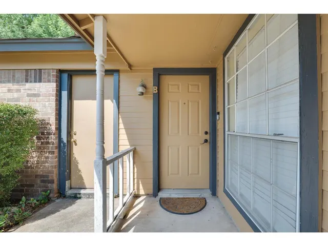 a view of entryway with wooden floor and a yard