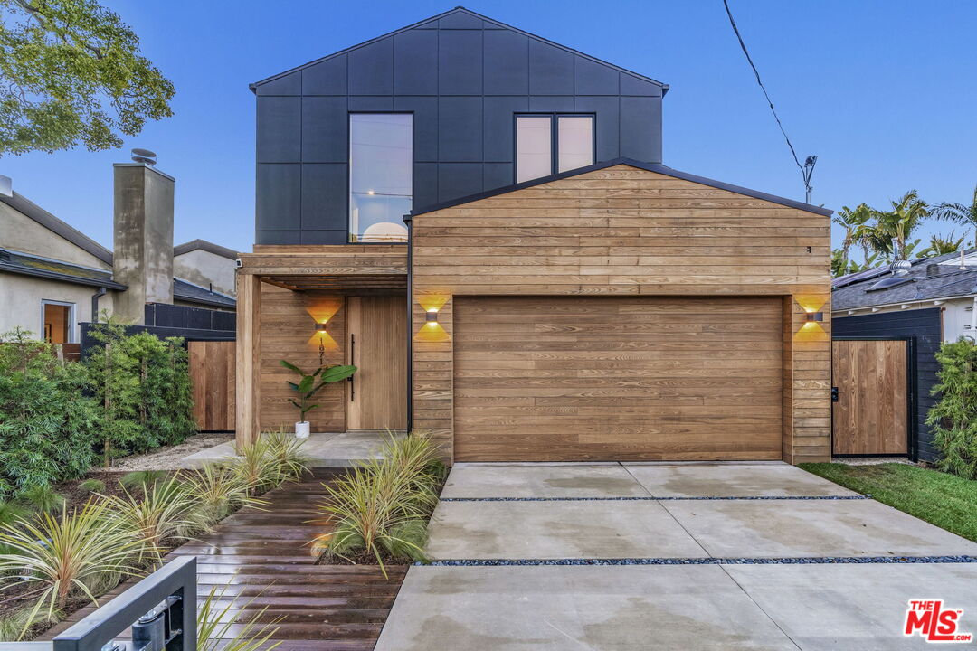 1071 Marco Place Venice, CA 90291 - Photo 1 of 39 a front view of a house with a yard