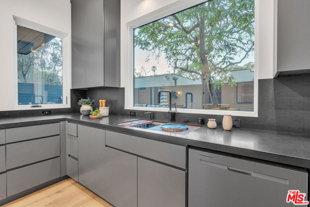 1071 Marco Place Venice, CA 90291 - Photo 12 of 39 a kitchen with a sink window and cabinets