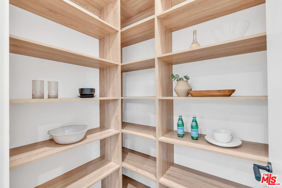 1071 Marco Place Venice, CA 90291 - Photo 13 of 39 a kitchen with white cabinets and wooden floor