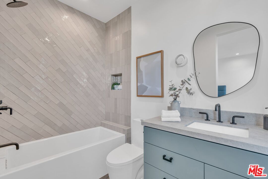 1071 Marco Place Venice, CA 90291 - Photo 17 of 39 a bathroom with a sink a toilet and a mirror