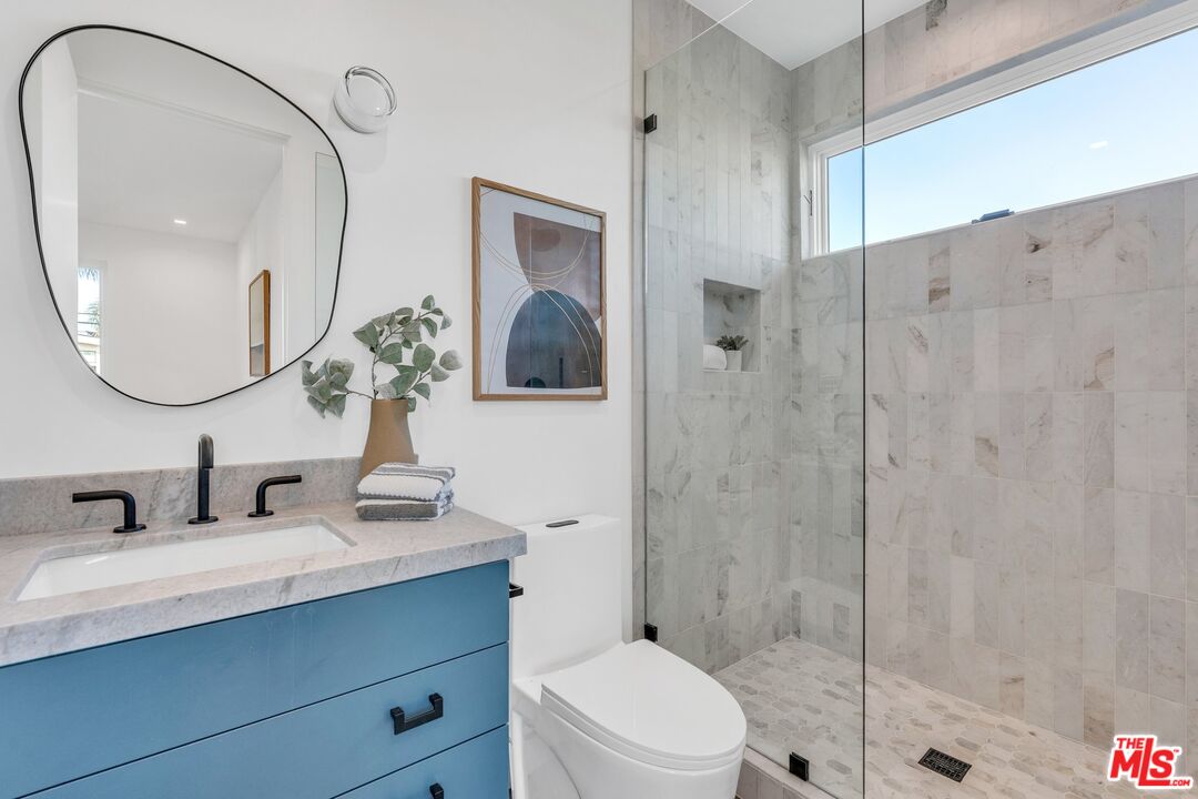 1071 Marco Place Venice, CA 90291 - Photo 19 of 39 a bathroom with a sink a toilet and shower