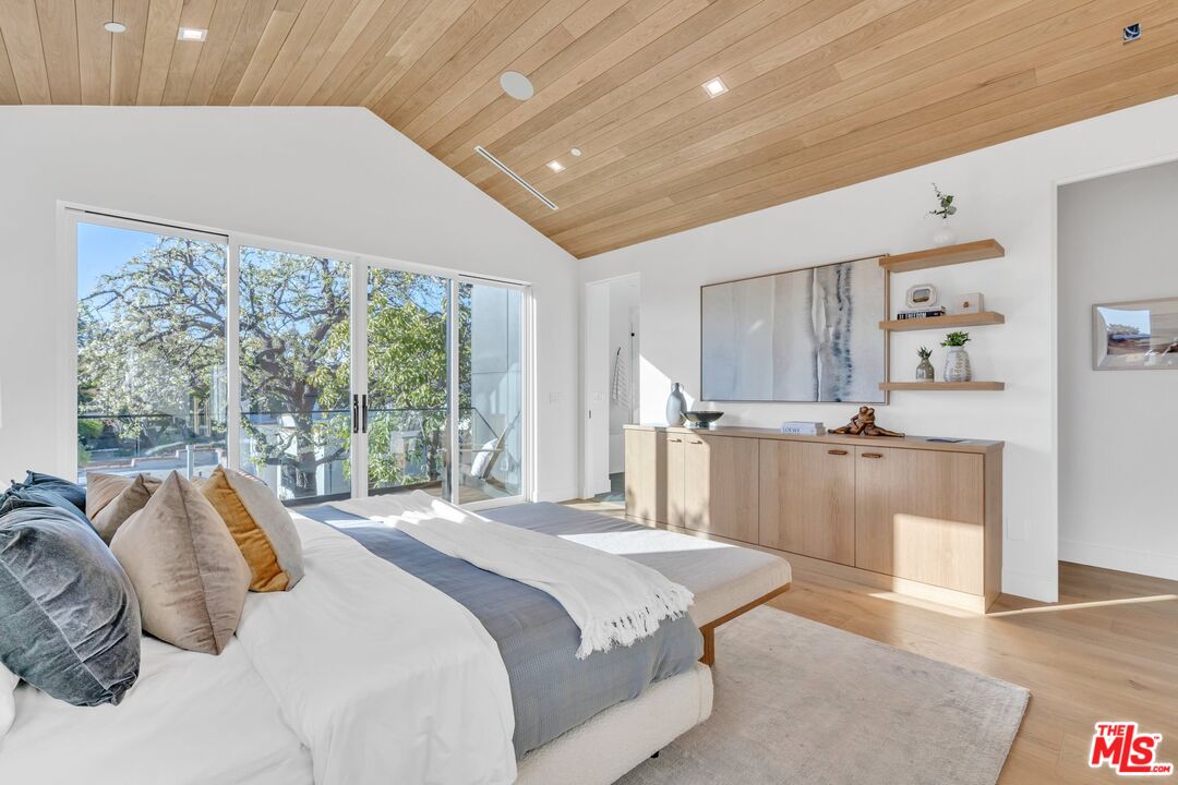 1071 Marco Place Venice, CA 90291 - Photo 21 of 39 a bedroom with a large bed and a balcony