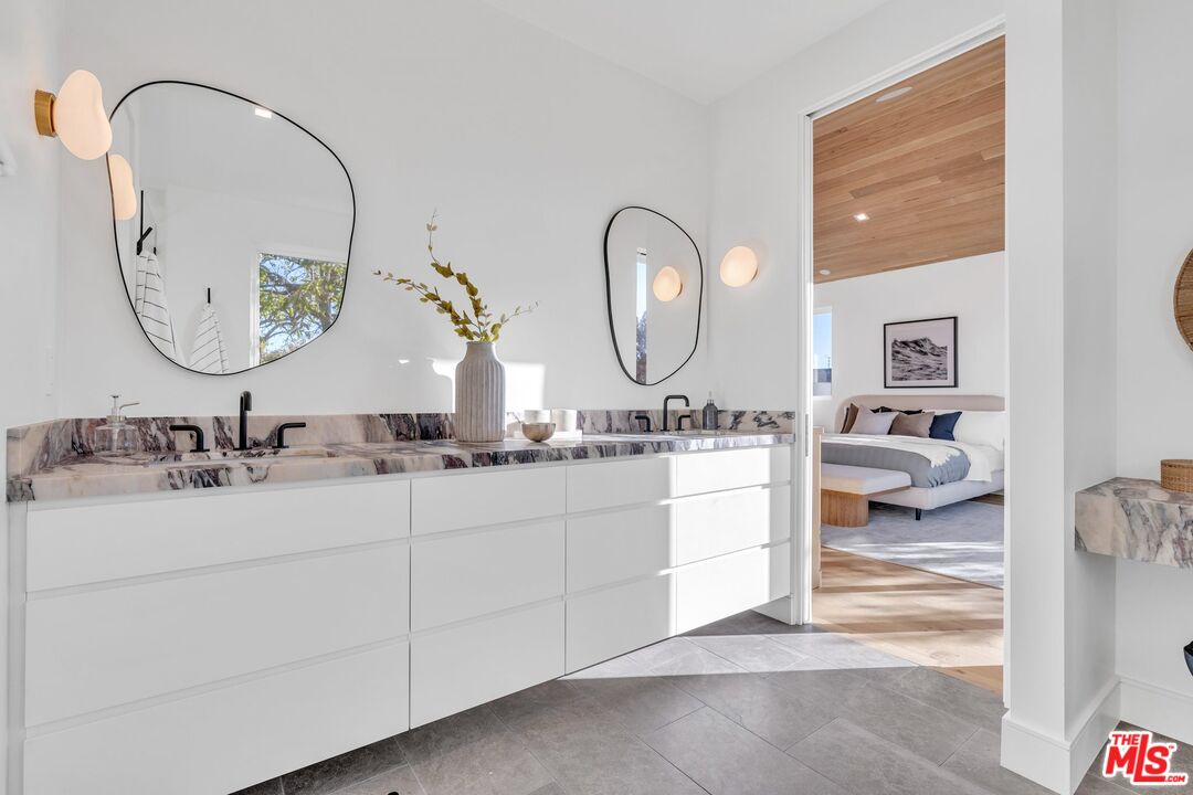 1071 Marco Place Venice, CA 90291 - Photo 23 of 39 a bathroom with a sink and a mirror