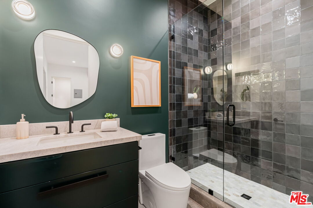 1071 Marco Place Venice, CA 90291 - Photo 31 of 39 a bathroom with a sink mirror toilet and shower