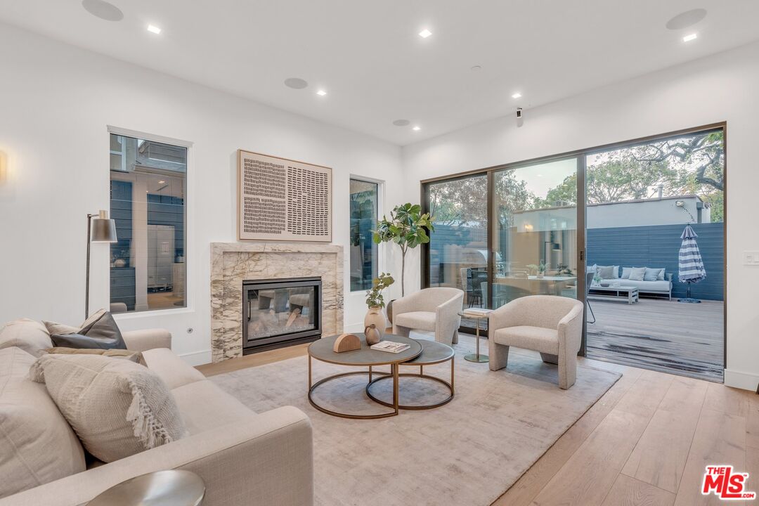 1071 Marco Place Venice, CA 90291 - Photo 7 of 39 a living room with furniture and a fireplace
