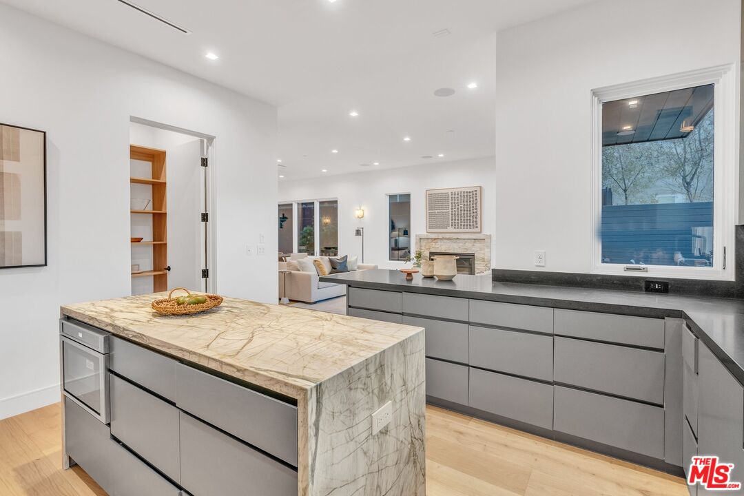 1071 Marco Place Venice, CA 90291 - Photo 9 of 39 a kitchen with a sink stove and cabinets