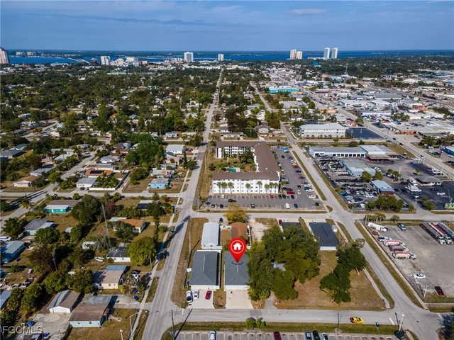 an aerial view of residential building and car parked