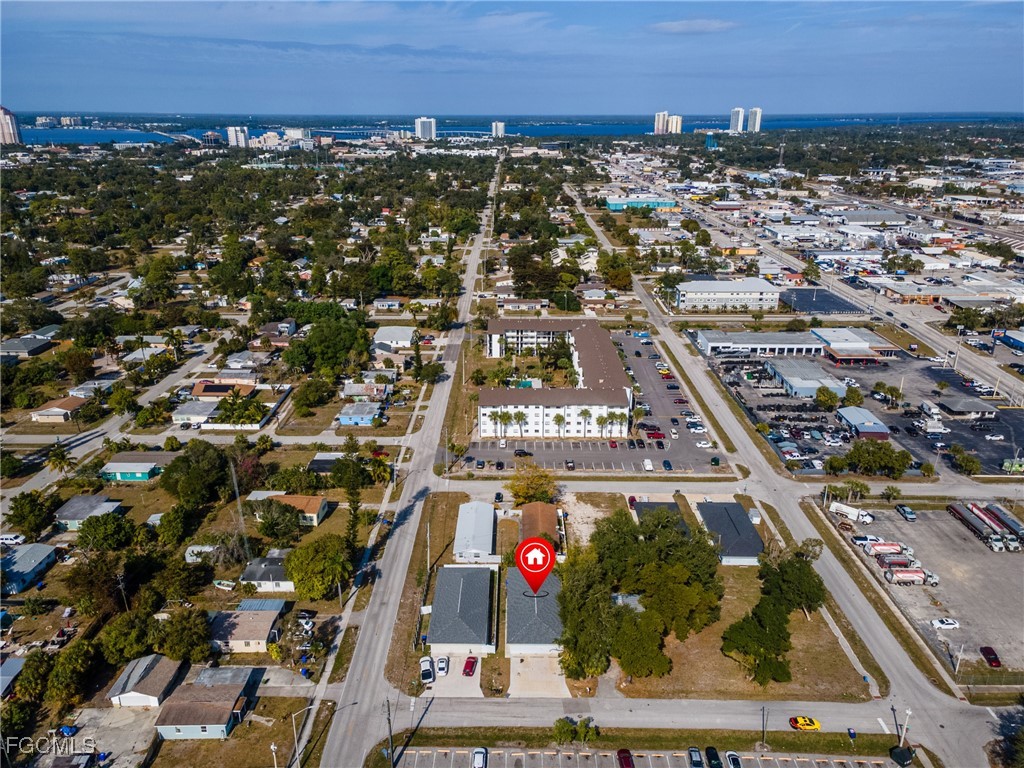 an aerial view of residential building and car parked