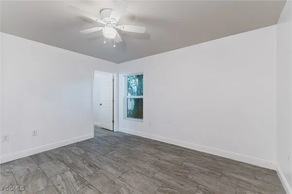 a view of an empty room with a window